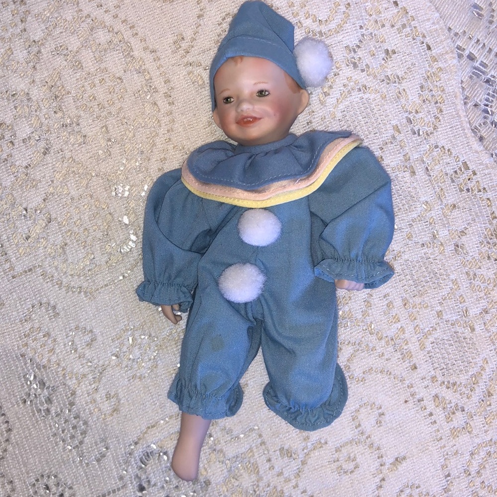 Ashton Drake Cute Clown in Blue with White Pom Poms. He does have both legs